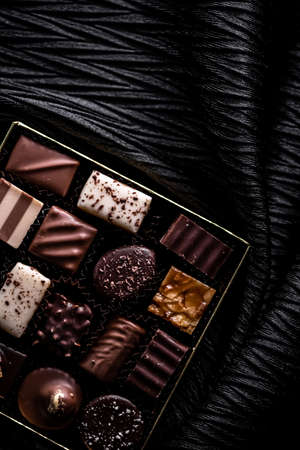 Swiss chocolates in gift box, various luxury pralines made of dark and milk organic chocolate in chocolaterie in Switzerland, sweet dessert food as holiday present and premium confectionery brandの写真素材