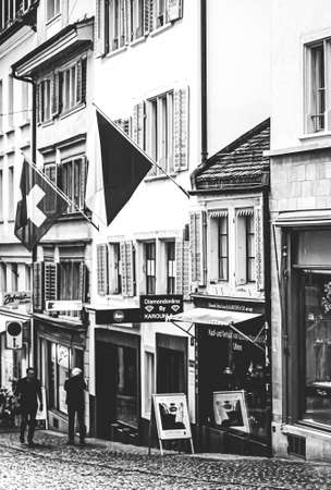 Vintage monochrome view of historic Old Town, shops and luxury stores near main downtown...