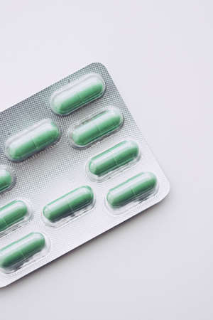 Green pills and capsules as nutrition supplement, wellness and healthcare