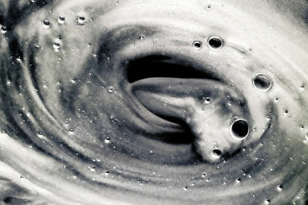 Abstract silver liquid background, paint splash, swirl pattern and water drops, beauty gel and cosmetic texture, contemporary magic art and science as luxury flatlay designの写真素材