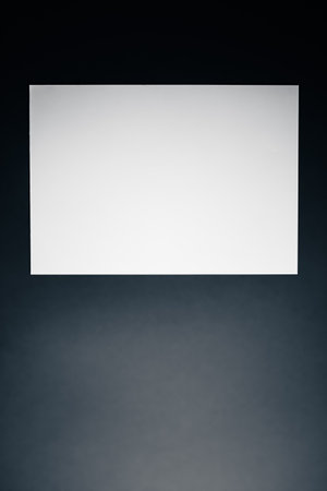 Blank A4 paper, white on black background as office stationery flatlay, luxury branding flat lay and brand identity design for mockupの写真素材