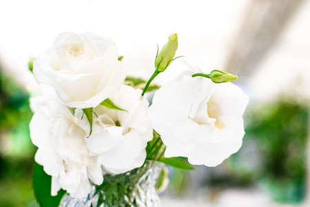 Wedding decoration, table decor and floral beauty, bouquet of white roses in luxury restaurant, beautiful flowers from summer gardenの写真素材