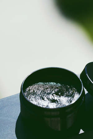 Organic cosmetics, black face mask in jar, natural green line skincare for healthy skin and body careの写真素材