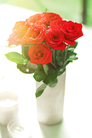 Bouquet of red roses as floral holiday gift, beautiful fresh garden flowers as home decorの写真素材