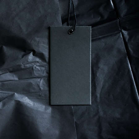 Black luxe clothing tag, sustainable fashion and brand label conceptの写真素材