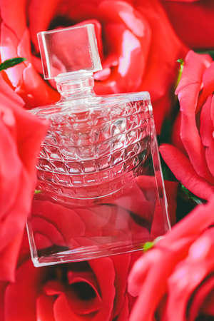 Spring floral scent, perfume bottle in roses, perfumery as luxury gift, beauty flatlay background...