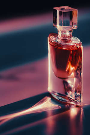 Perfume bottle at sunset, perfumery as luxury beauty and cosmetic productの写真素材
