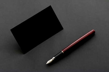 Blank black business card for mockup and vintage pen, luxury branding and corporate identity designの写真素材