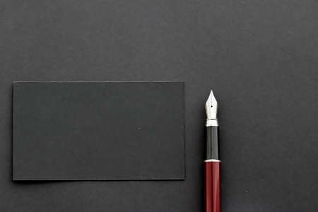 Blank black business card for mockup and pen as office flatlay background, luxury branding and...