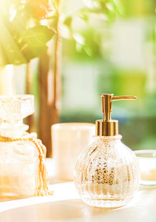Soap dispenser at bathroom spa, home decor and interior design. Hand cream or antibacterial liquid...
