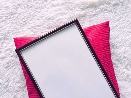 Black wooden frame and pink pillow for print mockup, luxury home decor and interior design, poster...