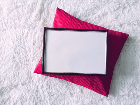 Black wooden frame and pink pillow for print mockup, luxury home decor and interior design, poster and printable artの写真素材