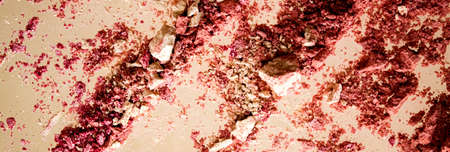 Crushed cosmetics, mineral organic eyeshadow, blush and cosmetic powder isolated on golden background, makeup and beauty banner, flatlay designの写真素材
