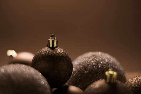 Christmas holiday and festive decoration concept. Golden baubles on beige backgroundの写真素材