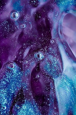 Abstract purple liquid background, paint splash, swirl pattern and water drops, beauty gel and...