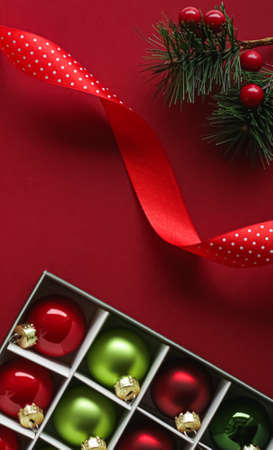 Christmas flatlay and holiday design concept. Decoration, ornament and xmas gift wrapping on red...