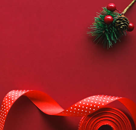 Christmas flatlay and holiday design concept. Decoration, ornament and xmas gift wrapping on red paper background as flat lay top viewの写真素材