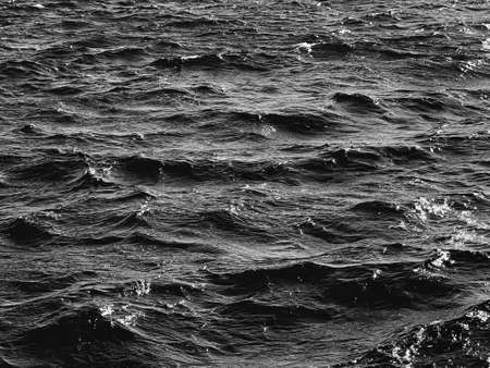Sea, texture and coastal nature concept. Ocean water as black and white, monochrome surface backgroundの写真素材