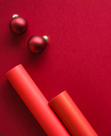Christmas flatlay and holiday design concept. Decoration, ornament and xmas gift wrapping on red...