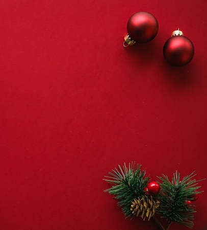 Christmas flatlay and holiday design concept. Decoration, ornament and xmas gift wrapping on red paper background as flat lay top viewの写真素材