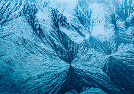 Winter background and Christmas art concept. Ice frost on frozen window glass with natural frosty pattern and texture design as holiday card backdropの写真素材