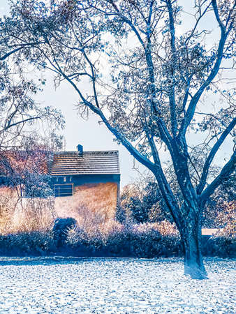 Christmas fantasy landscape and winter wonderland background. Snowy mountain village by the sea at holiday eveningの写真素材