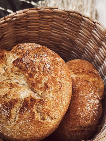 Fresh bread in a basket, rustic style food, bakery