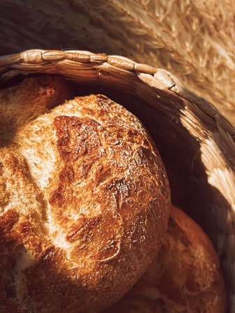 Fresh bread in a basket, rustic style food, bakery