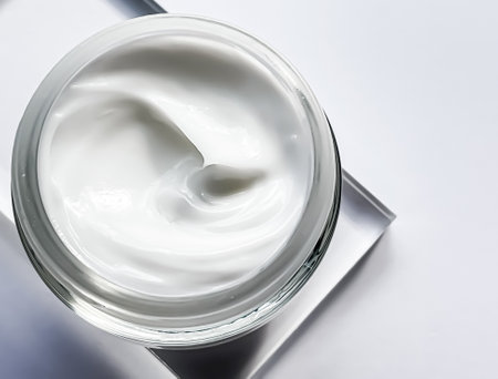 Face cream moisturiser jar and product sample on glass, beauty and skincare, cosmetic science conceptの写真素材
