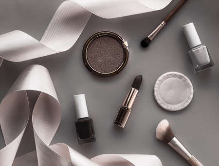Beauty, make-up and cosmetics flatlay design with copyspace, cosmetic products and makeup tools on gray background, girly and feminine style conceptの写真素材