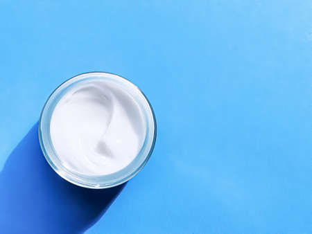 Face cream moisturiser jar as product sample on blue background, beauty and skincare, cosmetic science conceptの写真素材