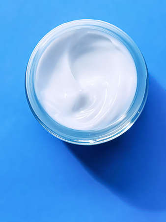 Face cream moisturiser jar as product sample on blue background, beauty and skincare, cosmetic science conceptの写真素材