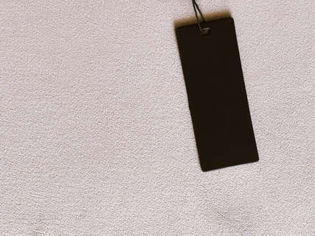 Luxury black fashion label tag, sale price card on fabric background, shopping and retail concept