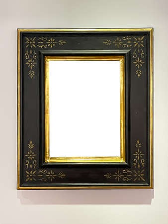 Antique wooden art fair gallery frame on the wall at auction house or museum exhibition, blank...