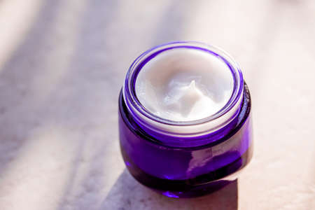 Moisturising beauty cream, skincare and spa cosmetics on stone background in summer at sunset, cosmetic product and skin care conceptの写真素材