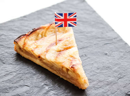 Slice of apple pie and british flag, tart dessert and sweet food conceptの写真素材