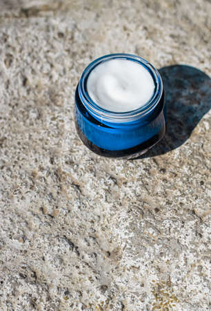 Moisturising beauty cream, skincare and spa cosmetics on stone background in summer at sunset, cosmetic product and skin care conceptの写真素材