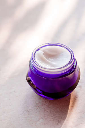 Moisturising beauty cream, skincare and spa cosmetics on stone background in summer at sunset, cosmetic product and skin care conceptの写真素材