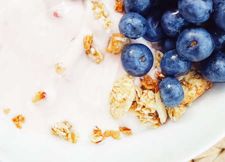 Blueberry yogurt cereal bowl as healthy breakfast and morning meal, sweet food and organic berry...