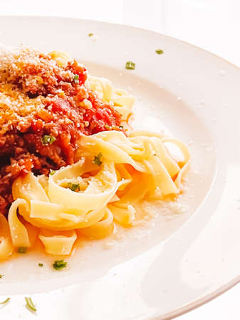 Pasta with bolognese sauce and parmesan cheese, homemade food and dinner menu recipeの写真素材