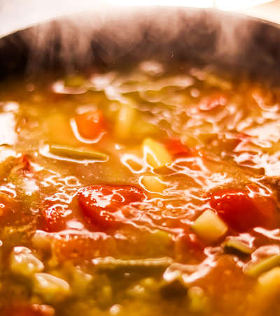 Cooking vegetable soup in saucepan, comfort food and homemade mealの写真素材