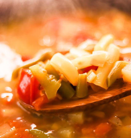 Cooking vegetable soup in saucepan, comfort food and homemade mealの写真素材