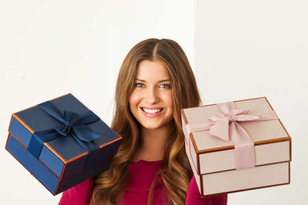 Happy woman holding gifts for birthday, anniversary, wedding, Valentines day or Christmas, luxury...