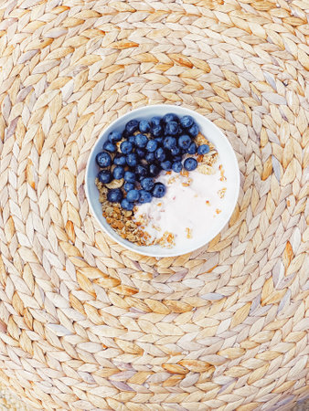 Blueberry yogurt cereal bowl as healthy breakfast and morning meal, sweet food and organic berry fruit, diet and nutrition conceptの写真素材