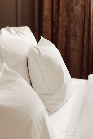 Home decor and interior design, bed with white bedding in luxury bedroom, bed linen laundry service and furniture detailsの写真素材