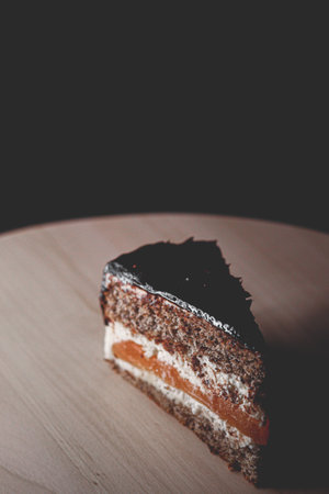 Dessert and sweet food, slice of layered cake with cream, caramel and chocolate as holiday treat...