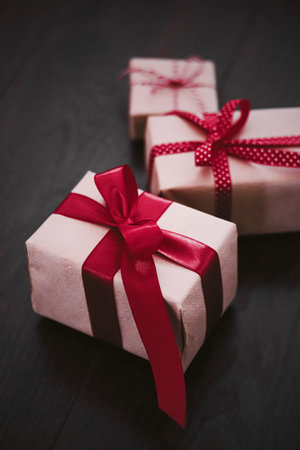 Christmas gifts and traditional holiday presents, classic xmas gift boxes on wooden background,...