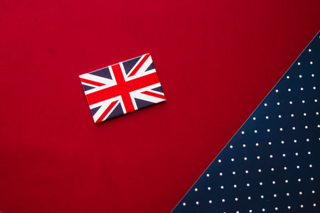 Abstract flat lay backdrop, the Union Jack on red and blue polka dot background, perfect for holiday projects or high-end product promotion.の写真素材