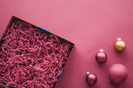 Christmas holiday gift and beauty box subscription package mockup for luxury xmas present or product, empty open gift box flat lay on pink background as online shopping delivery, flatlay copyspaceの写真素材
