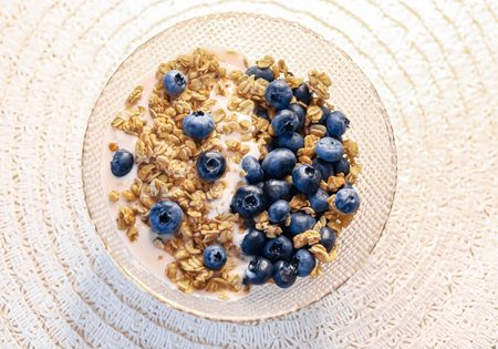 Breakfast idea and delicious food, breakfast cereal grains with lactose-free yoghurt and fresh organic blueberries in a bowl, tasty and healthy recipe, food photographyの写真素材
